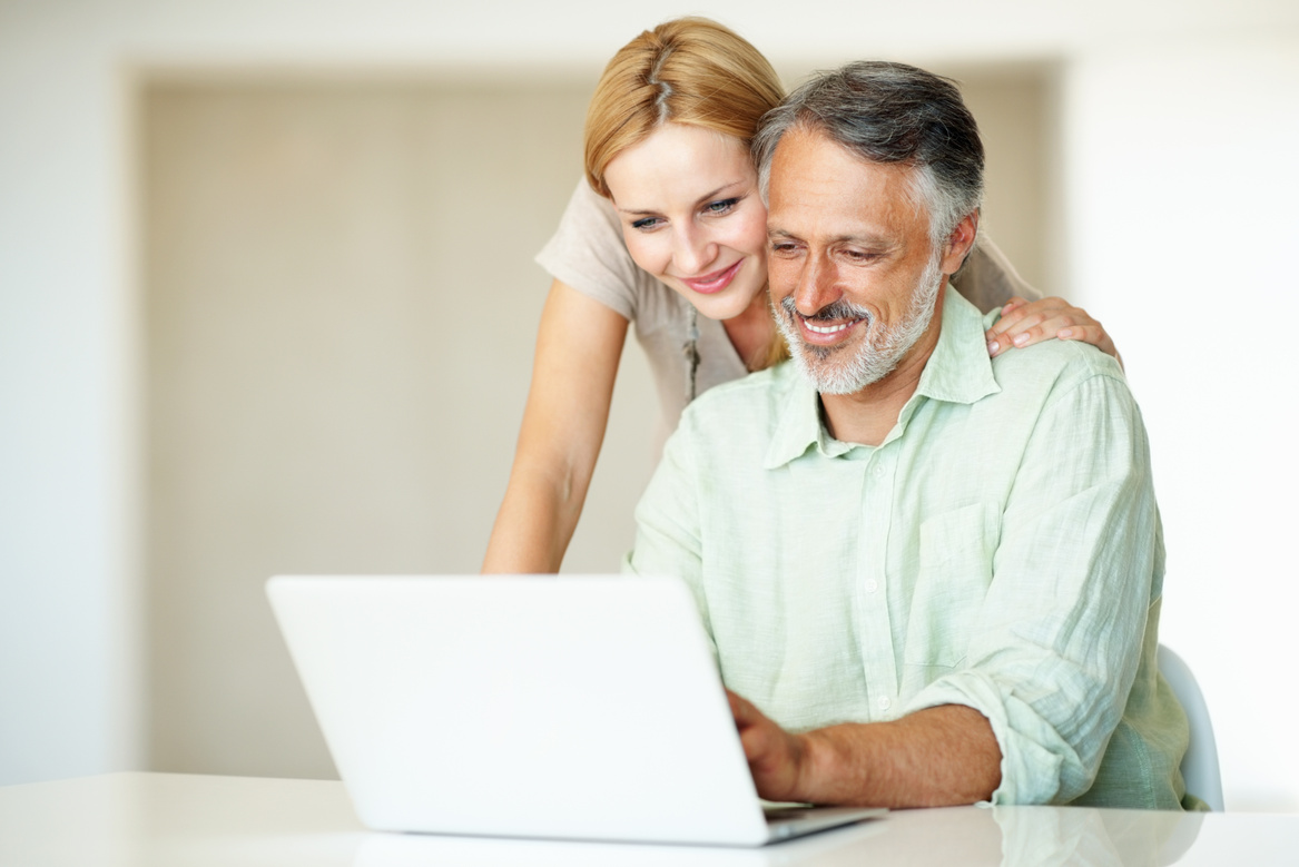 Couple looking at laptop screen